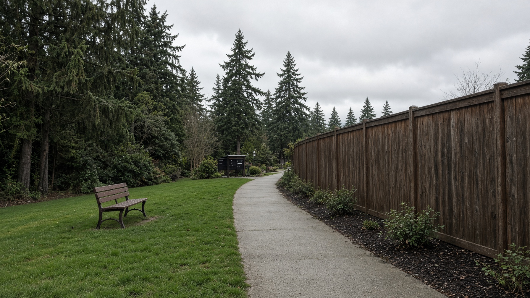 HOA walking path beside a cedar fence